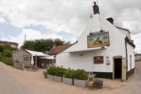 The Stiffkey Red Lion from the Coast Road