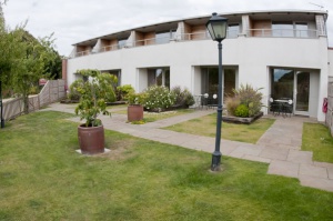 Approaching our eco-friendly rooms across the garden